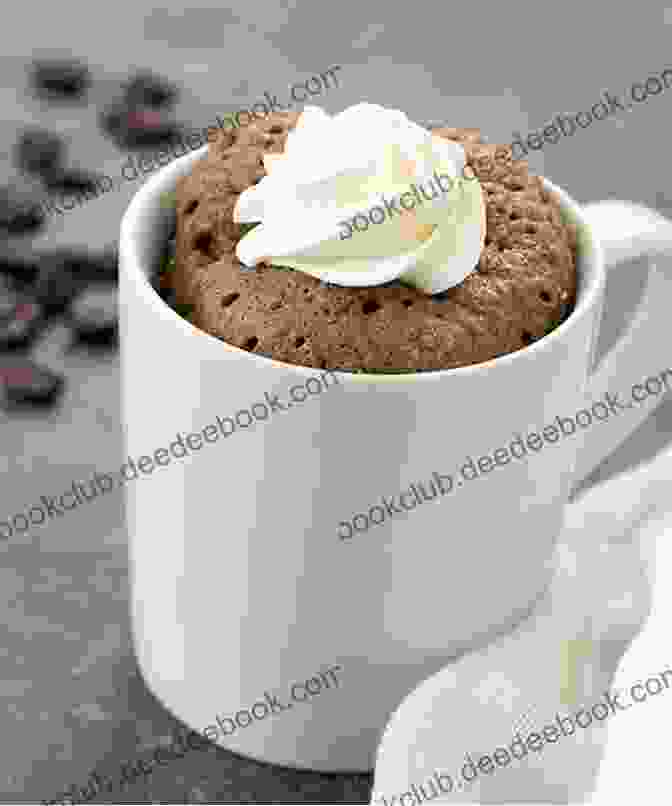 A Single Serving Keto Mug Cake Topped With A Dollop Of Whipped Cream Ketogenic Diet Recipes: Recipes For Making Keto Desserts